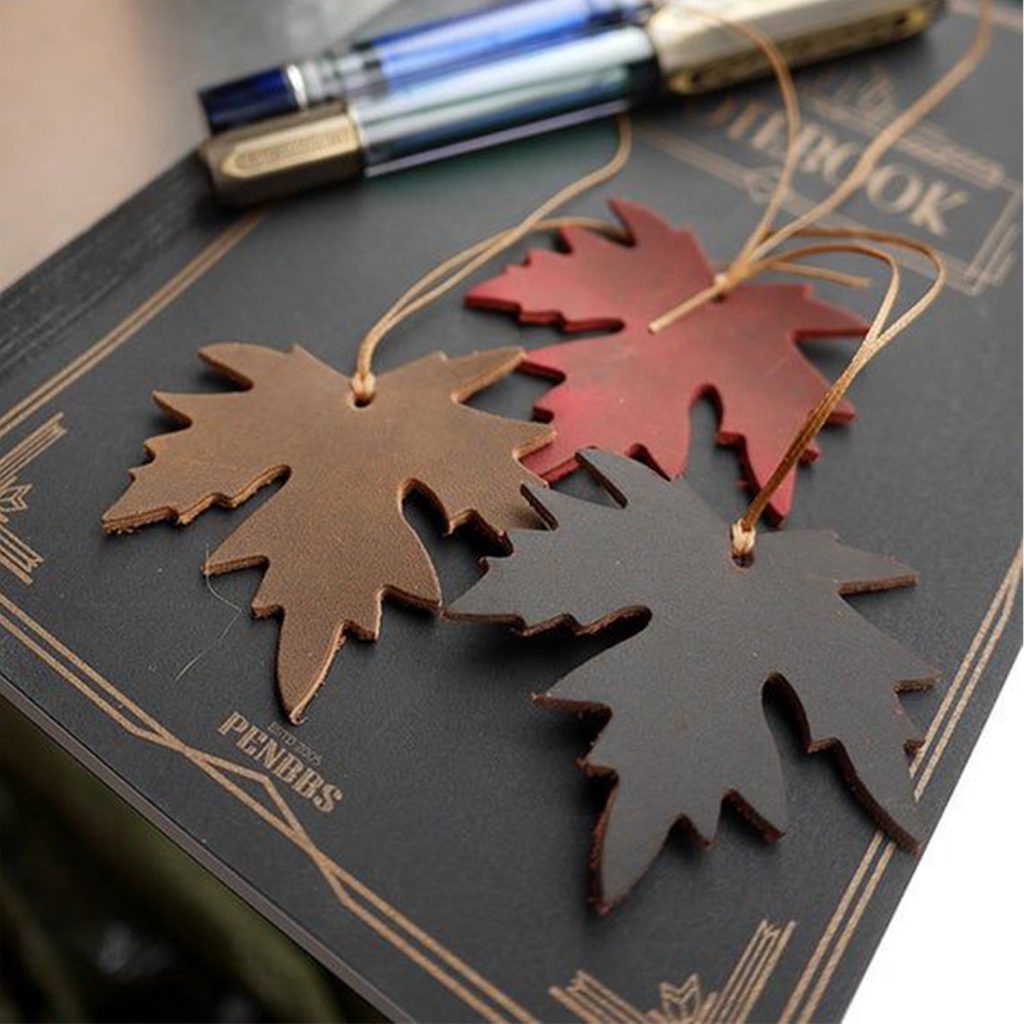 Pendentif de sac à main en cuir découpé au laser CO₂